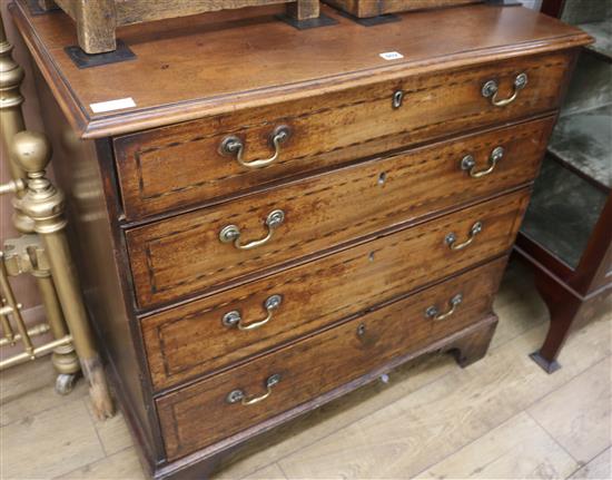 A George III inlaid mahogany chest of drawers, W.96cm